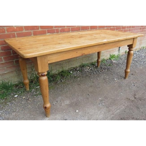 812 - A vintage pine kitchen table, originally purchased by the vendor from Heal’s, on tapering turned sup... 