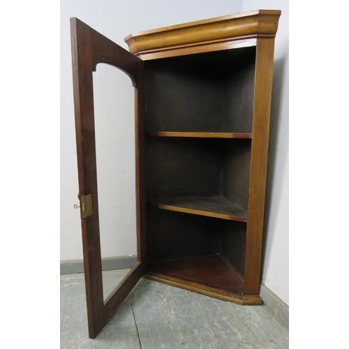 813 - A large Victorian mahogany corner cupboard, the glazed door opening onto two fitted shelves. 
H126cm... 