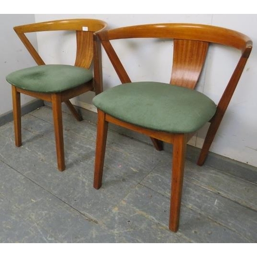 818 - A pair of mid-century beech tub chairs by Greaves & Thomas, the seats covered in emerald green velve... 