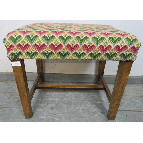 820 - A rustic 19th century oak stool, reupholstered in multi-coloured woollen material with brass studs, ... 