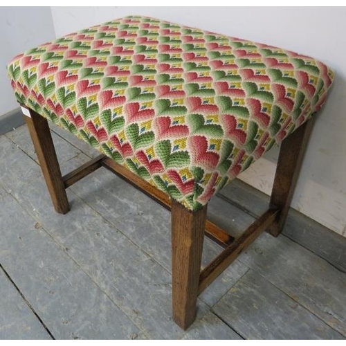 820 - A rustic 19th century oak stool, reupholstered in multi-coloured woollen material with brass studs, ... 