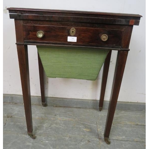 821 - A Regency Period rosewood turnover worktable, the folding top over one long frieze drawer with inter... 