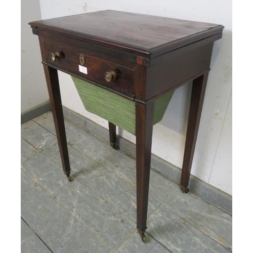 821 - A Regency Period rosewood turnover worktable, the folding top over one long frieze drawer with inter... 