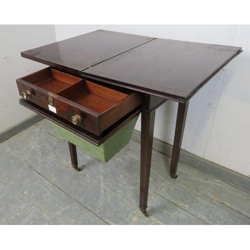 821 - A Regency Period rosewood turnover worktable, the folding top over one long frieze drawer with inter... 