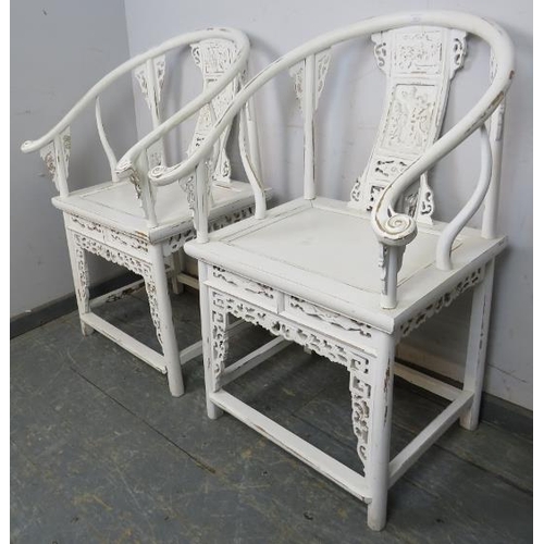 822 - A pair of vintage Chinese horseshoe chairs in the 18th century taste, painted white and distressed, ... 