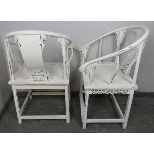 822 - A pair of vintage Chinese horseshoe chairs in the 18th century taste, painted white and distressed, ... 