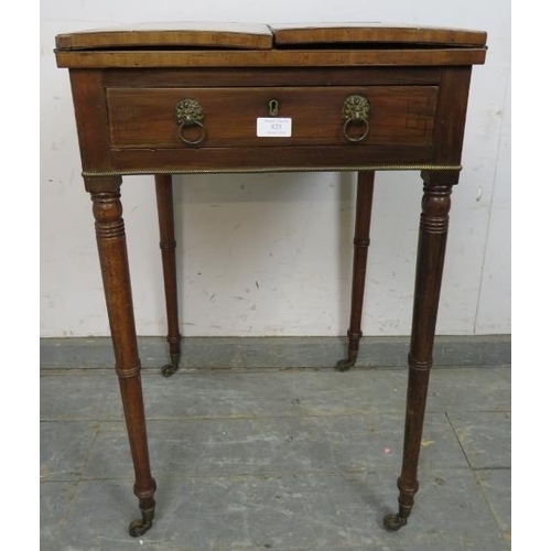 823 - A Regency Period mahogany card table, the folding top with brass and ebony inlaid border, above one ... 