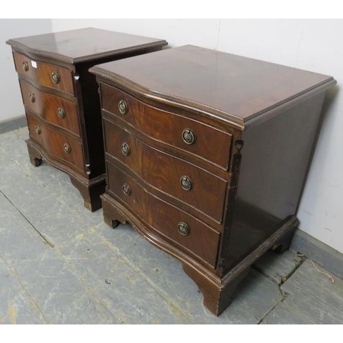 833 - A pair of reproduction mahogany serpentine fronted bedside chests in the Georgian taste, each housin... 