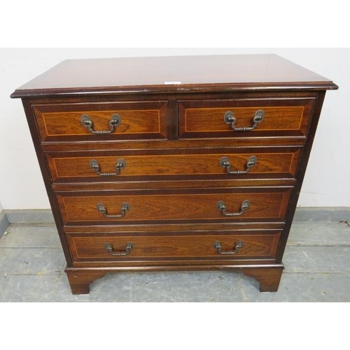 834 - A reproduction mahogany chest in the Georgian taste, crossbanded and strung with satinwood, housing ... 