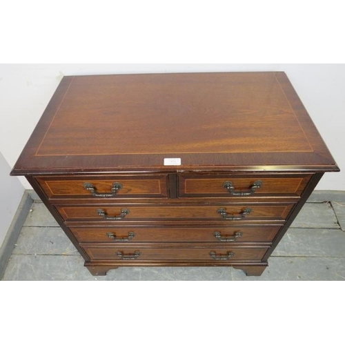 834 - A reproduction mahogany chest in the Georgian taste, crossbanded and strung with satinwood, housing ... 