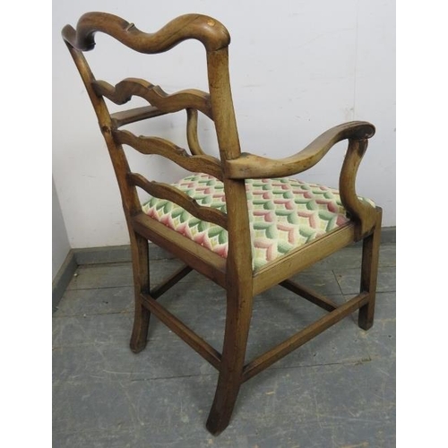 838 - A Georgian mahogany elbow chair, having shaped ladder-back and scrolled armrests, the drop-in seat p... 