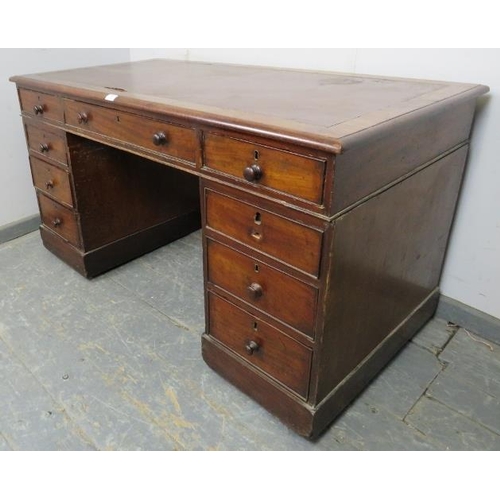 842 - A 19th century mahogany pedestal desk, housing a configuration of nine graduated oak-lined drawers w... 