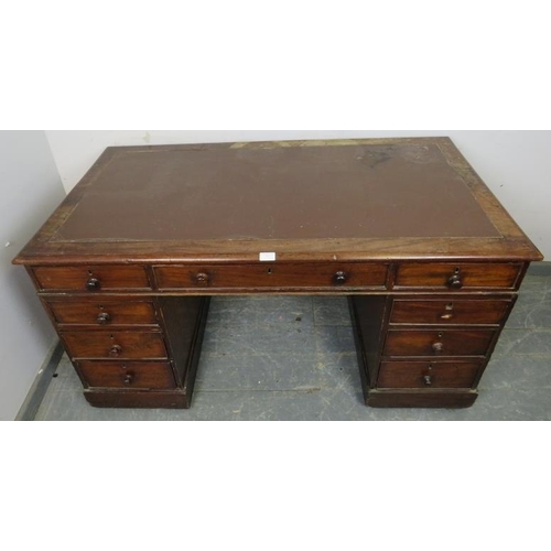 842 - A 19th century mahogany pedestal desk, housing a configuration of nine graduated oak-lined drawers w... 