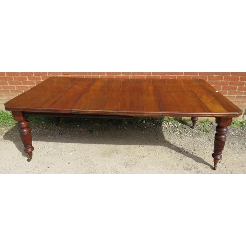 847 - A Regency Revival mahogany wind-out extending dining table, with two additional leaves, on turned an... 