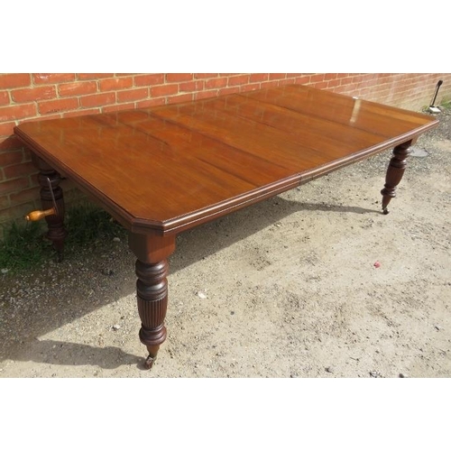 847 - A Regency Revival mahogany wind-out extending dining table, with two additional leaves, on turned an... 