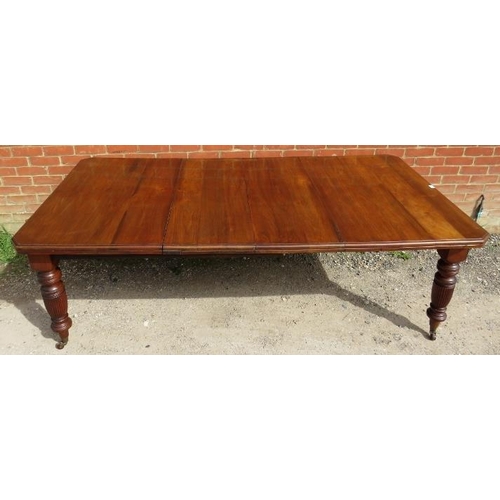 847 - A Regency Revival mahogany wind-out extending dining table, with two additional leaves, on turned an... 