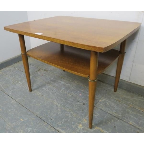 850 - A mid-century walnut two-tier coffee table, on tapering supports.
H53cm W70cm D56cm (approx).
Condit... 