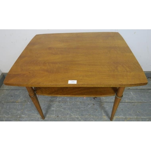 850 - A mid-century walnut two-tier coffee table, on tapering supports.
H53cm W70cm D56cm (approx).
Condit... 