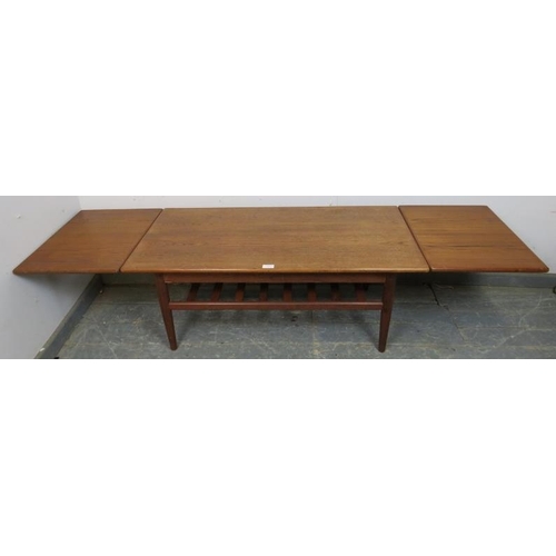 859 - A mid-century Danish teak coffee table by Trioh, having draw-leaf extending sides, on turned support... 