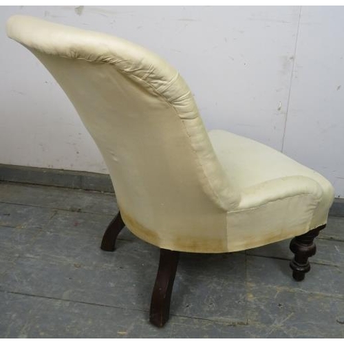 860 - A Victorian mahogany bedroom chair, upholstered in calico with loose red fabric cover, on tapering t... 