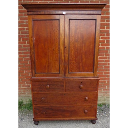 861 - A Victorian mahogany linen press of good colour, the moulded cornice above panelled doors opening on... 