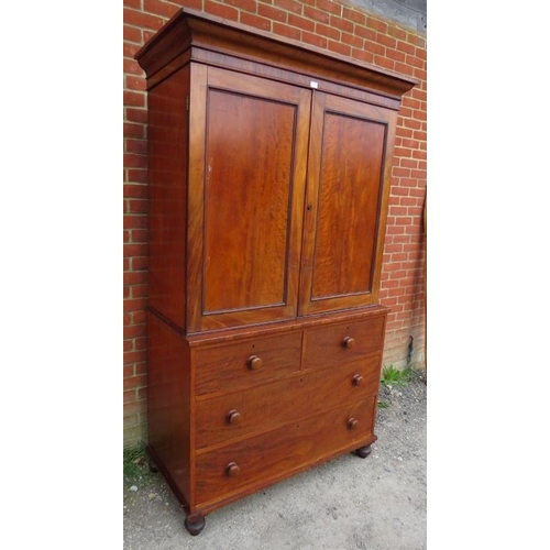 861 - A Victorian mahogany linen press of good colour, the moulded cornice above panelled doors opening on... 