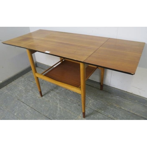 862 - A mid-century teak drop-leaf two-tier table, with chamfered and ebonised edge above a galleried unde... 