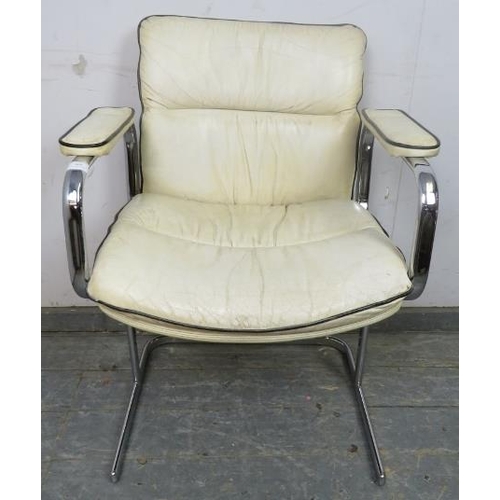 868 - A mid-century desk chair in the manner of Peiff, upholstered in cream leather with black piping, on ... 