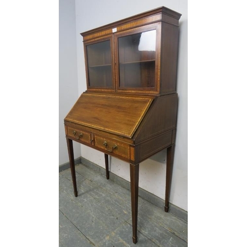 869 - An Edwardian mahogany bonheur du jour, crossbanded with walnut and boxwood and ebony strung, the top... 