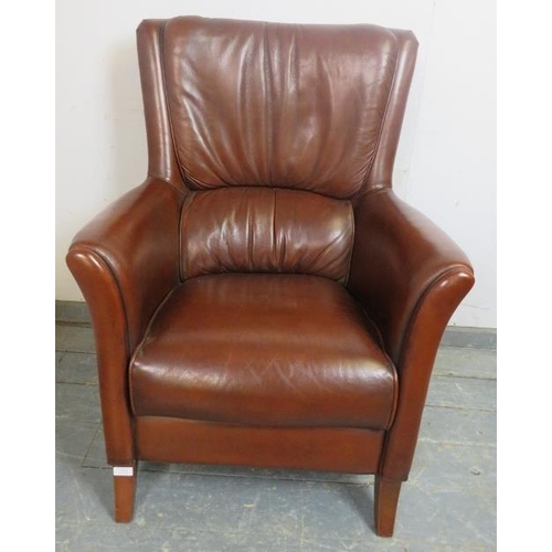 872 - A contemporary armchair, upholstered in tobacco brown leather, on sabre legs. 
H98cm W72cm D76cm (ap... 