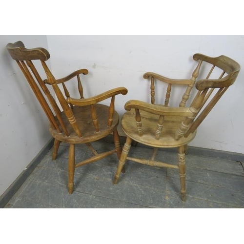 884 - A matched pair of antique elm and beech His & Hers penny elbow chairs, on canted turned supports wit... 