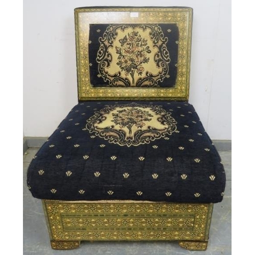 885 - A highly decorative ottoman seat, upholstered in navy material with tapestry decoration, the back an... 