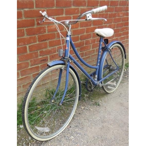 A vintage 1980s Raleigh Chiltern ladies bicycle in cornflower blue with white vinyl seat on a 20 f