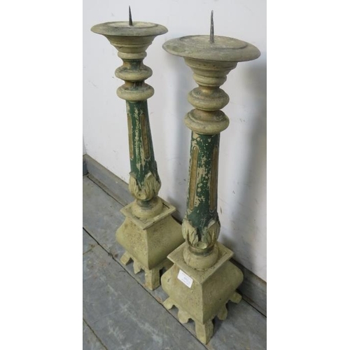 892 - A pair of large painted freestanding candle holders, the fluted columns with carved acanthus leaf de... 