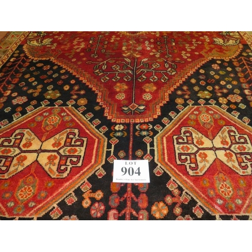 904 - A South West Persian Qashgai carpet, central motif, blue, cream & burnt amber field, very thick pile... 