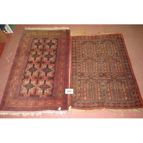 908 - Two Rugs - An early 20th century rug, six repeat pattern motifs. 123cm x 90cm (approx).
Condition re... 