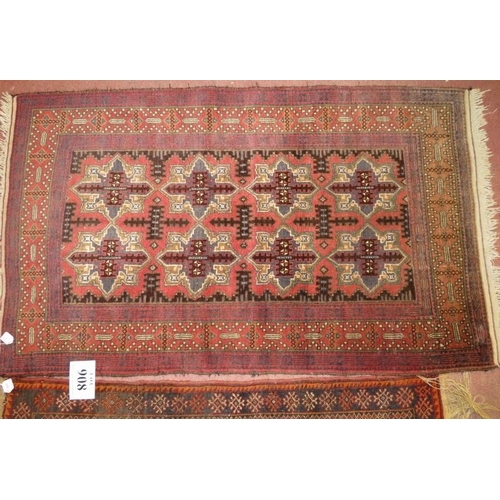 908 - Two Rugs - An early 20th century rug, six repeat pattern motifs. 123cm x 90cm (approx).
Condition re... 