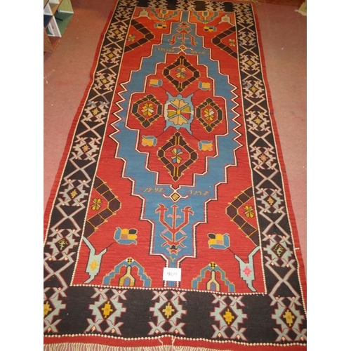 909 - A large 20th century Armenian Kilim rug, vibrant colours, blue on burnt amber field. 340cm x 161cm (... 