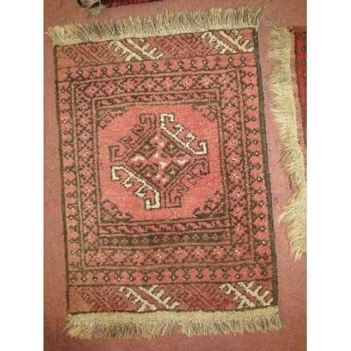 919 - Four assorted small rugs, Afghan/Persian. Smallest 75cm x 50cm (approx). Largest 130cm x 44cm (appro... 