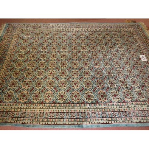 920 - A 20th century Persian rug, central repeat patter on blue ground. 240cm x 160cm max (approx).
Condit... 