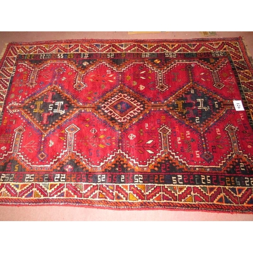 921 - South West Persian Lori rug, three central diamond motif on red ground and depicting stylised animal... 