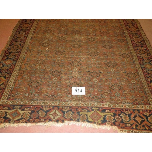 924 - A 19th century Persian rug, central repeat pattern on brown ground. 290cm x 160cm (approx).
Conditio... 