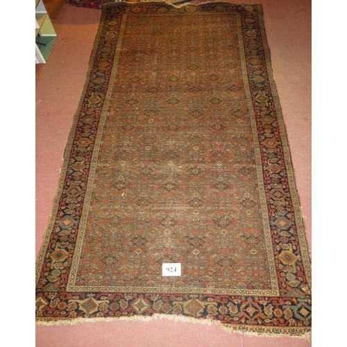 924 - A 19th century Persian rug, central repeat pattern on brown ground. 290cm x 160cm (approx).
Conditio... 