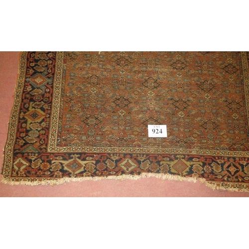 924 - A 19th century Persian rug, central repeat pattern on brown ground. 290cm x 160cm (approx).
Conditio... 