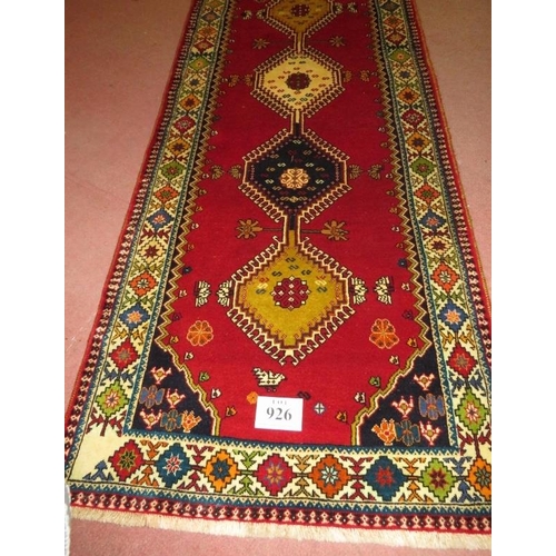 926 - South West Persian Qashgai runner, central motifs, mustard, blue & cream on a red ground. 250cm x 98... 