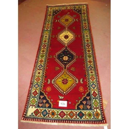 926 - South West Persian Qashgai runner, central motifs, mustard, blue & cream on a red ground. 250cm x 98... 