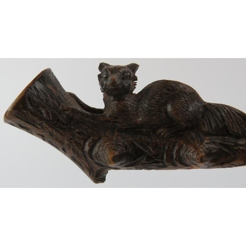 100 - Three Black Forest carved cheroot pipes. Two surmounted with bears and the other with a recumbent fo... 