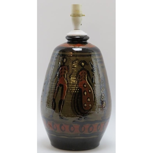 103 - A European studio pottery table lamp, mid 20th century. Hand painted with a continuous scene depicti... 