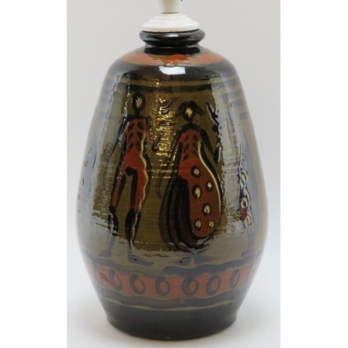 103 - A European studio pottery table lamp, mid 20th century. Hand painted with a continuous scene depicti... 