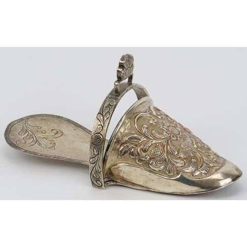 106 - A Peruvian plated copper ladies stirrup, 19th century. Of slipper form, repoussé decorated with flow... 